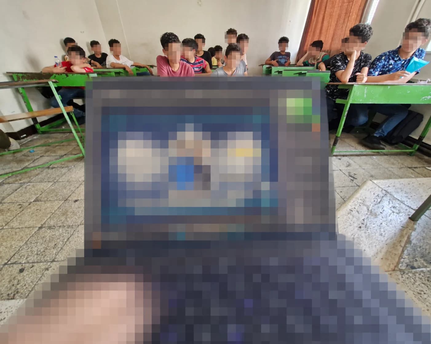 Students learning in a computer classroom