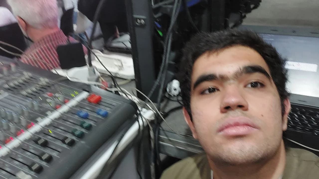 Ali beside audio and video control equipment